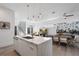 Modern kitchen with island, opens to living room with stylish furniture at 830 W Canton Ave, Winter Park, FL 32789