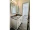 Clean bathroom with granite countertop and mirrored medicine cabinet at 8429 Sw 105Th Pl, Ocala, FL 34481