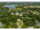 Aerial view of a residential lot with surrounding houses and lake at 858 Cardinal Pointe Cv, Sanford, FL 32771