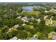 Aerial view of a residential area near a lake, showcasing a lot at 858 Cardinal Pointe Cv, Sanford, FL 32771