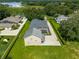 Aerial view of house, pool, and backyard near lake at 858 Cardinal Pointe Cv, Sanford, FL 32771