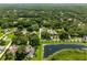 Aerial view of neighborhood with pond and houses at 858 Cardinal Pointe Cv, Sanford, FL 32771