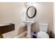 Elegant powder room with pedestal sink and oval mirror at 858 Cardinal Pointe Cv, Sanford, FL 32771