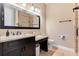 Bathroom with granite countertop, dark vanity and shower at 858 Cardinal Pointe Cv, Sanford, FL 32771