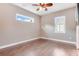 Bright bedroom with hardwood floors and window with shutters at 858 Cardinal Pointe Cv, Sanford, FL 32771