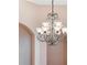 Close-up of a beautiful chandelier with frosted glass shades at 858 Cardinal Pointe Cv, Sanford, FL 32771