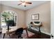 Home office with built-in desk and large window overlooking backyard at 858 Cardinal Pointe Cv, Sanford, FL 32771