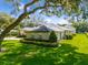 Side view of house, showing landscaping and detached garage at 858 Cardinal Pointe Cv, Sanford, FL 32771