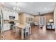 Open kitchen with white cabinets, stainless steel appliances and wood flooring at 858 Cardinal Pointe Cv, Sanford, FL 32771