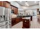 Gourmet kitchen features stainless steel appliances and dark wood cabinetry at 858 Cardinal Pointe Cv, Sanford, FL 32771