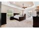 Large main bedroom with backyard access and tray ceiling at 858 Cardinal Pointe Cv, Sanford, FL 32771