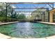 Stunning pool with a water feature and screened enclosure at 858 Cardinal Pointe Cv, Sanford, FL 32771