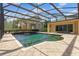 Resort-style pool with water feature and screened enclosure at 858 Cardinal Pointe Cv, Sanford, FL 32771