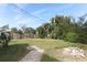 Large backyard with fire pit and brick walkway at 913 Carlson Dr, Orlando, FL 32804