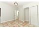 Simple bedroom with tiled floors and access to hallway at 913 Carlson Dr, Orlando, FL 32804