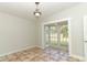 Dining room with tiled floor and French doors to backyard at 913 Carlson Dr, Orlando, FL 32804