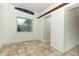 Empty dining room with tiled floors and large window at 913 Carlson Dr, Orlando, FL 32804