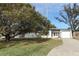 Ranch style home with carport and mature landscaping at 913 Carlson Dr, Orlando, FL 32804