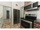 Kitchen with stainless steel appliances and brick backsplash at 913 Carlson Dr, Orlando, FL 32804