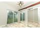 Laundry room with mirrored closet doors and backyard access at 913 Carlson Dr, Orlando, FL 32804