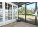 Screened porch with tiled floor and backyard access at 913 Carlson Dr, Orlando, FL 32804