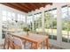 Bright sunroom with wood table and chairs at 913 Carlson Dr, Orlando, FL 32804