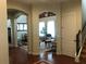 Spacious entryway with hardwood floors and views of living and dining areas at 9132 Via Bella Notte, Orlando, FL 32836