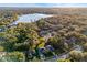 Aerial view of neighborhood with lake in the distance at 9451 Brownwood Ct, Oviedo, FL 32765