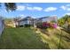 Landscaped backyard, showcasing the home's exterior and lush greenery at 9451 Brownwood Ct, Oviedo, FL 32765