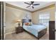 Cozy bedroom with double bed and dark wood furniture at 9451 Brownwood Ct, Oviedo, FL 32765