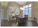 Formal dining room featuring hardwood floors and large windows at 9451 Brownwood Ct, Oviedo, FL 32765