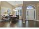 Elegant dining room with hardwood floors and a chandelier at 9451 Brownwood Ct, Oviedo, FL 32765