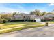 Brick house with a two-car garage and manicured lawn at 9451 Brownwood Ct, Oviedo, FL 32765