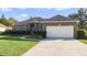 Brick house with neat landscaping and large yard at 9451 Brownwood Ct, Oviedo, FL 32765