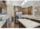 Modern kitchen with granite countertops and stainless steel appliances at 9451 Brownwood Ct, Oviedo, FL 32765