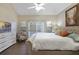 Main bedroom with plush carpet and private access to the balcony at 9451 Brownwood Ct, Oviedo, FL 32765