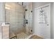 Large walk-in shower with glass enclosure and pebble floor at 9511 Nautique Ln, Winter Garden, FL 34787