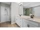 Double vanity bathroom with modern finishes and a large mirror at 9511 Nautique Ln, Winter Garden, FL 34787