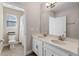 Double vanity bathroom with updated fixtures and a toilet at 9511 Nautique Ln, Winter Garden, FL 34787