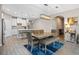 Bright dining room features a large table and modern light fixture at 9511 Nautique Ln, Winter Garden, FL 34787