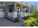 Inviting front porch with stone pillars and landscaping at 9511 Nautique Ln, Winter Garden, FL 34787