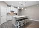 Well-equipped kitchen featuring white cabinets and an island at 9511 Nautique Ln, Winter Garden, FL 34787