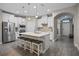 Modern kitchen with white cabinets, a large island, and stainless steel appliances at 9511 Nautique Ln, Winter Garden, FL 34787