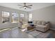 Relaxing living room featuring a sectional sofa and large windows at 9511 Nautique Ln, Winter Garden, FL 34787