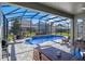 Inviting screened pool area with patio furniture and grill at 9511 Nautique Ln, Winter Garden, FL 34787