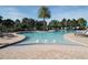 Relaxing pool with lounge chairs and palm trees at 9511 Nautique Ln, Winter Garden, FL 34787