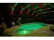 Inviting pool area with colorful LED lights illuminating the water at night at 9511 Nautique Ln, Winter Garden, FL 34787