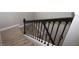 Elegant staircase with dark wood railing and wrought iron balusters at 9511 Nautique Ln, Winter Garden, FL 34787