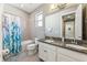 Bathroom with double vanity, granite countertop and bathtub at 1040 Sadie Ridge Rd, Clermont, FL 34715