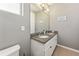 Bathroom with double vanity, granite countertop and toilet at 1040 Sadie Ridge Rd, Clermont, FL 34715